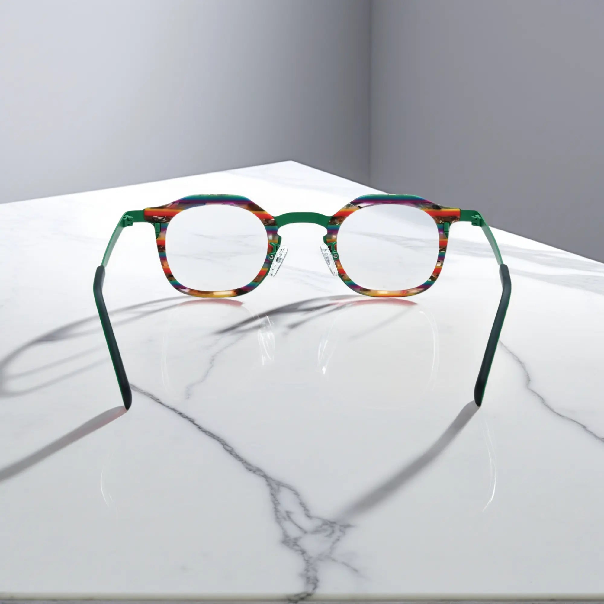 Rear view of VoyueLens™ Aurora Stripe eyeglasses showing a green-to-clear gradient acetate front and satin titanium temples.